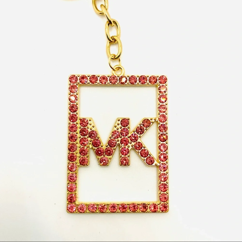 Purse Charm Key Chain MK Pink Crystals set in golden tone. BRAND NEW